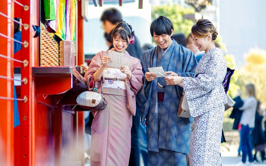 Visitors in traditional kimonos enjoying Gion's historic streets, Kyoto.
