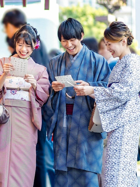 Visitors in traditional kimonos enjoying Gion's historic streets, Kyoto.