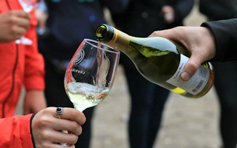 Tourist sampling wine at Cousiño Macul winery.