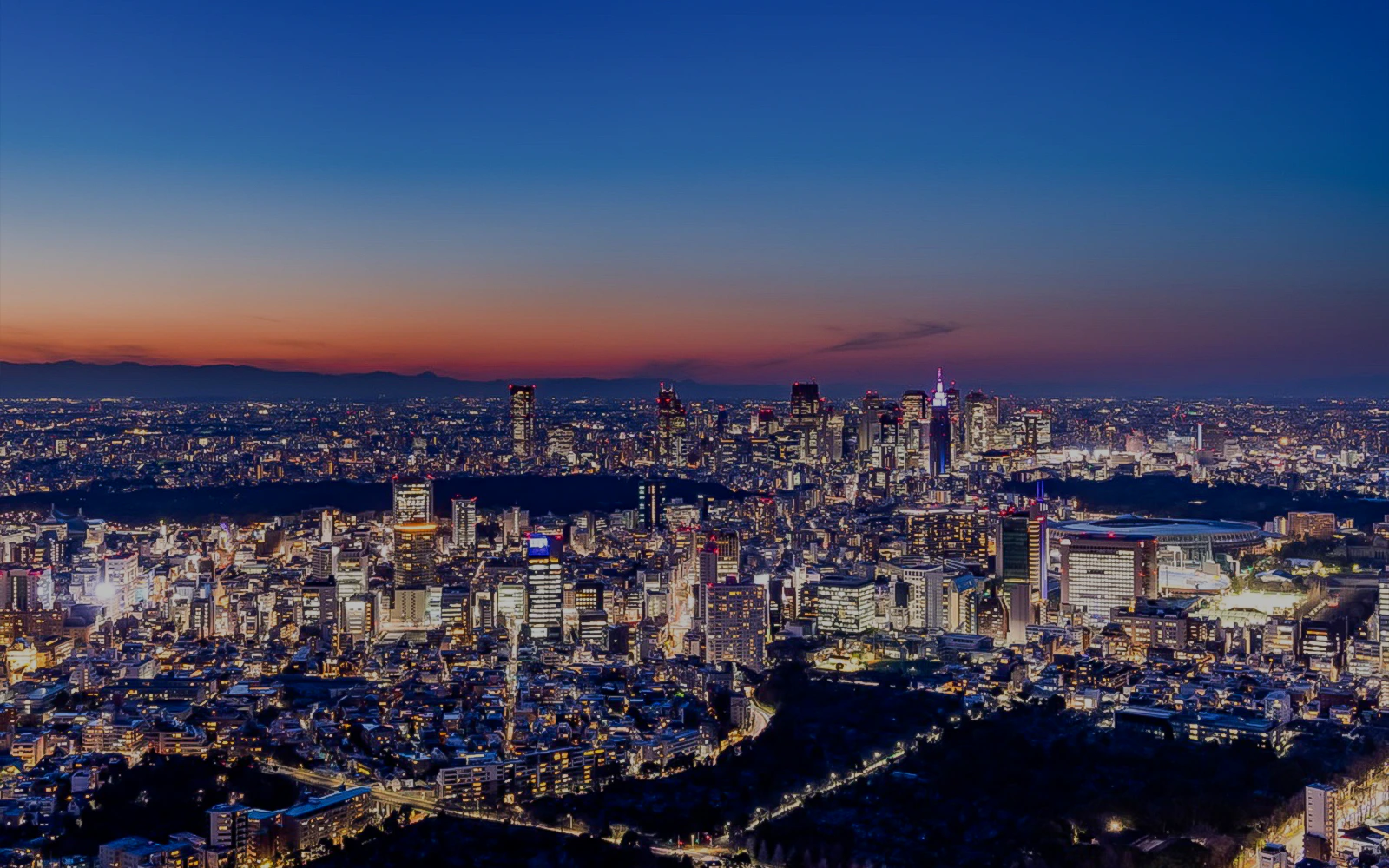 Tokyo skyline at sunset from Roppongi Hills Observation Deck.