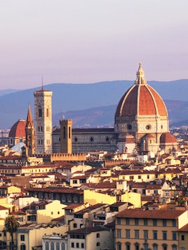 Florence skyline featuring the Duomo and Giotto's Campanile at sunset.