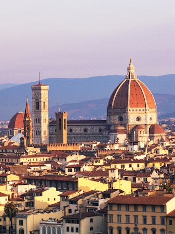 Florence skyline featuring the Duomo and Giotto's Campanile at sunset.