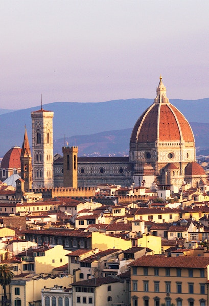 Florence skyline featuring the Duomo and Giotto's Campanile at sunset.