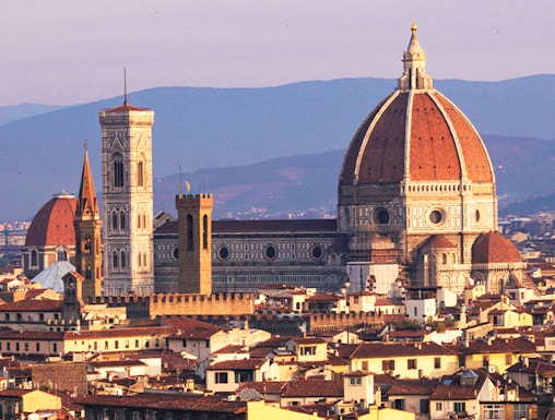 Florence skyline featuring the Duomo and Giotto's Campanile at sunset.