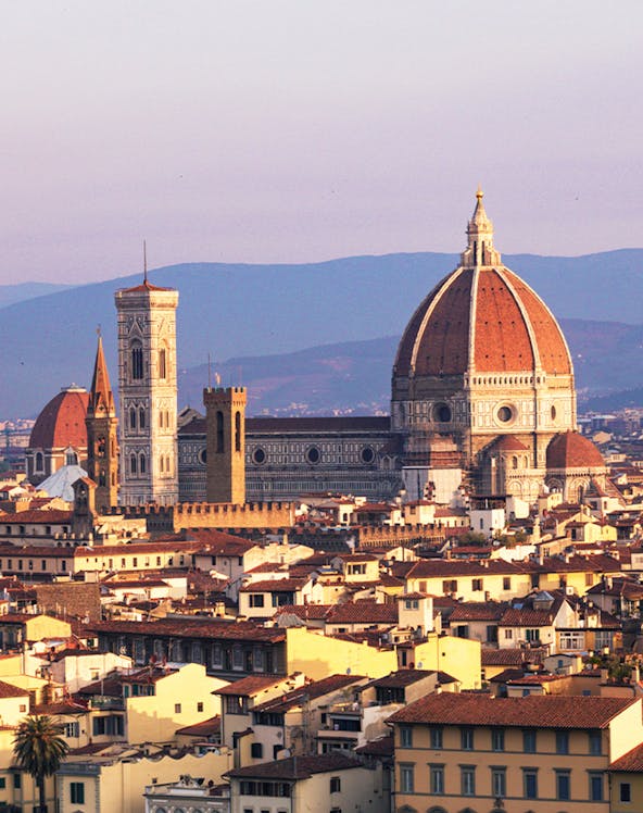 Florence skyline featuring the Duomo and Giotto's Campanile at sunset.