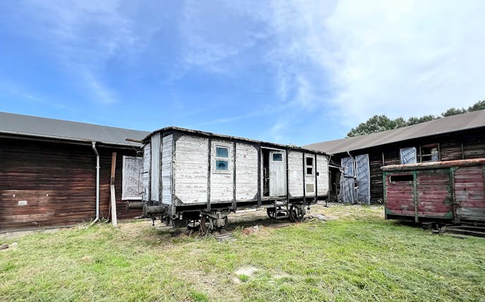 Historic train car at Auschwitz sub-camp, part of the Unknown History Exclusive Tour.