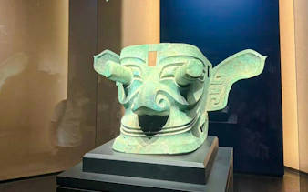 Sanxingdui bronze mask exhibit at Sanxingdui Museum, Chengdu.