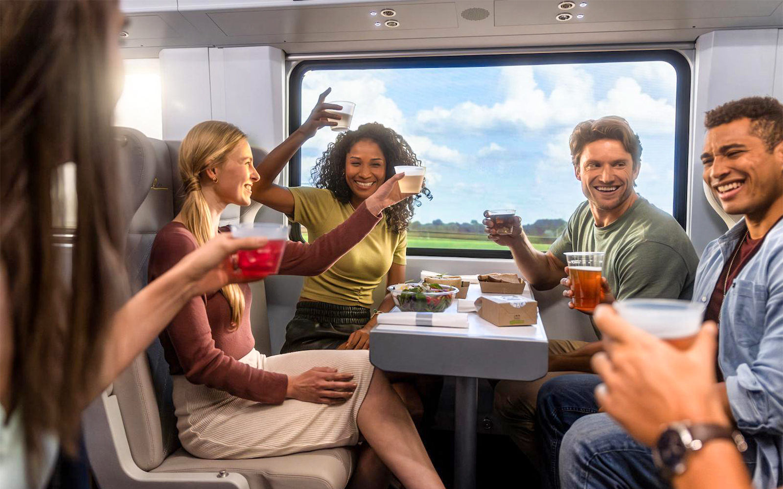 Group enjoying drinks on a train during Miami trip with open top bus and islands boat cruise.