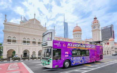 Open-top bus in front of Sultan Abdul Samad Building, Kuala Lumpur.