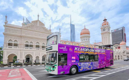 Open-top bus in front of Sultan Abdul Samad Building, Kuala Lumpur.