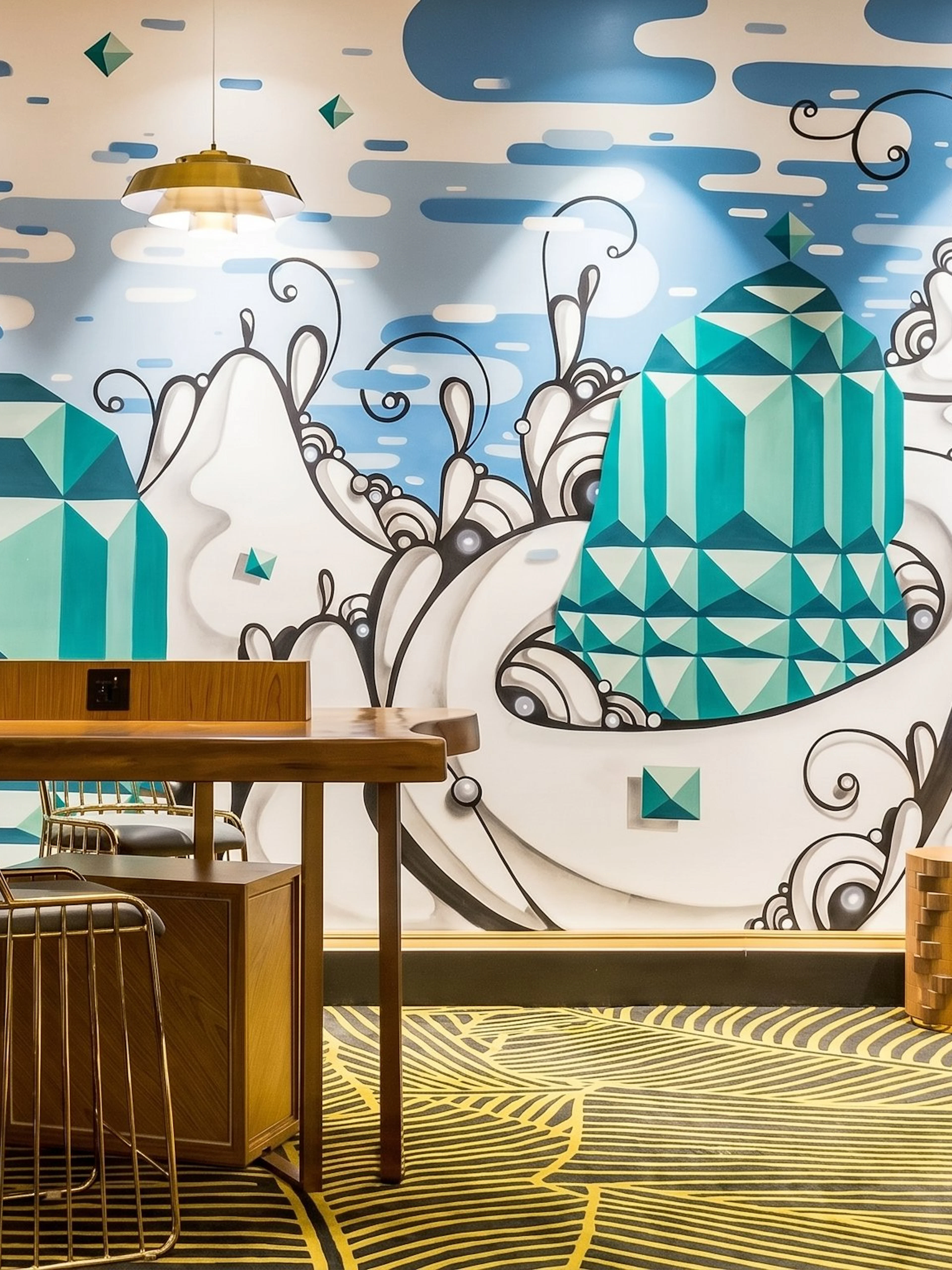 Plaza Premium Lounge seating area with artistic mural at Rio de Janeiro Airport, T2.