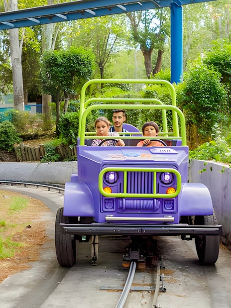 Children on Dora's Adventure ride at Parque de Atracciones de Madrid.