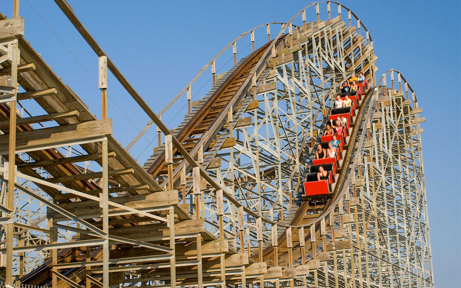 PortAventura Park Stampida wooden roller coaster with blue and red tracks in Salou, Spain.