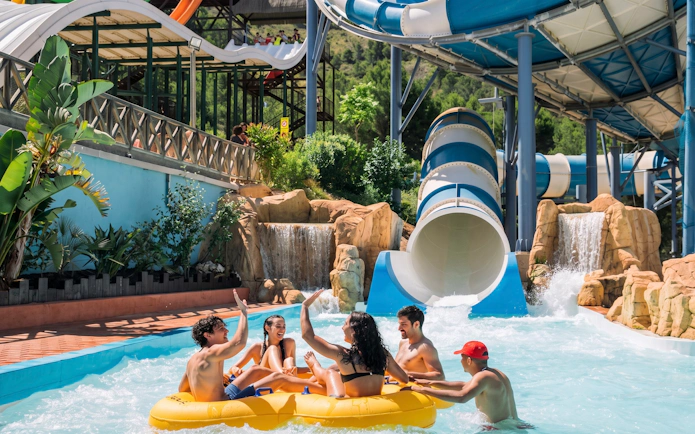 Group enjoying Cyclon water slide at Aqualandia Benidorm, Spain.