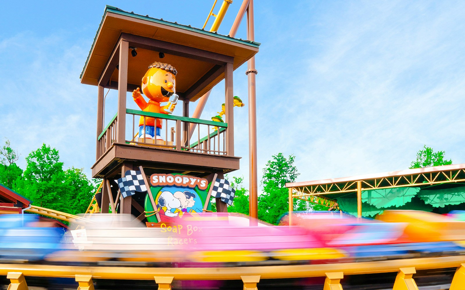 SNOOPY'S™ Soap Box Racers ride at Kings Island with colorful cars in motion.
