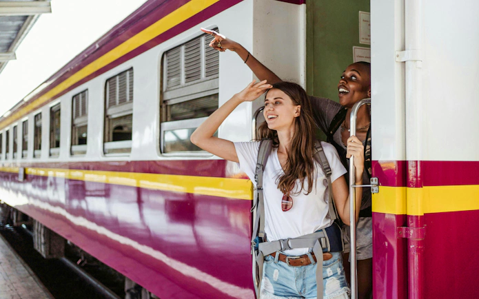 Passengers enjoying a train ride with BritRail Consecutive Pass on the National Rail network.