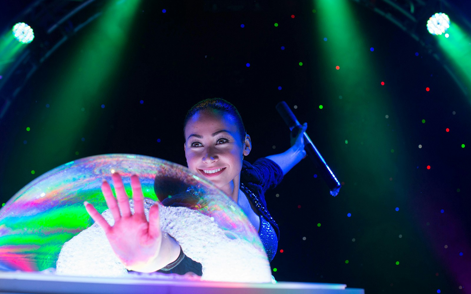 Performer creating large bubble at The Gazillion Bubble Show.
