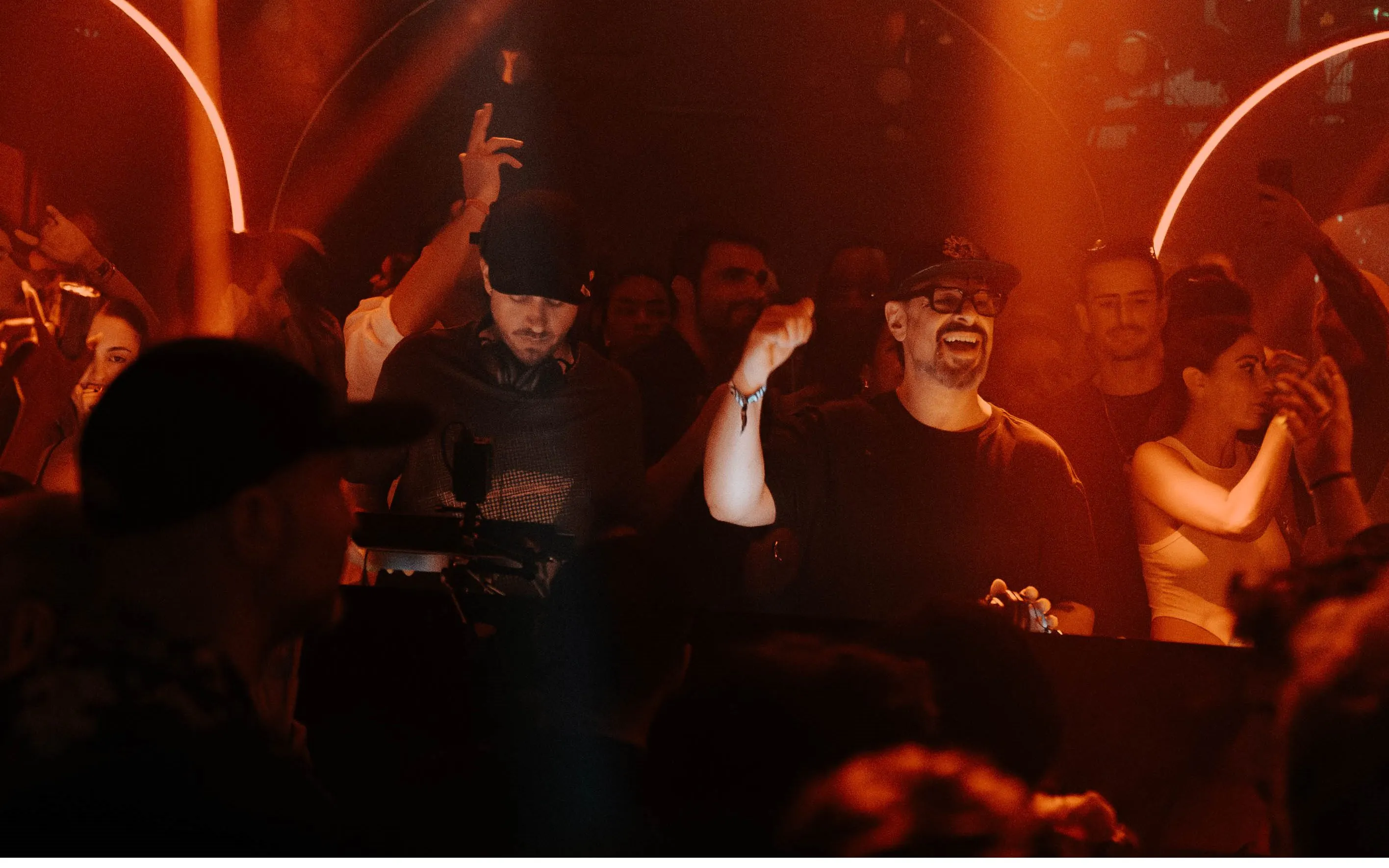 DJ performing at Club Chinois, Ibiza with crowd enjoying the music.