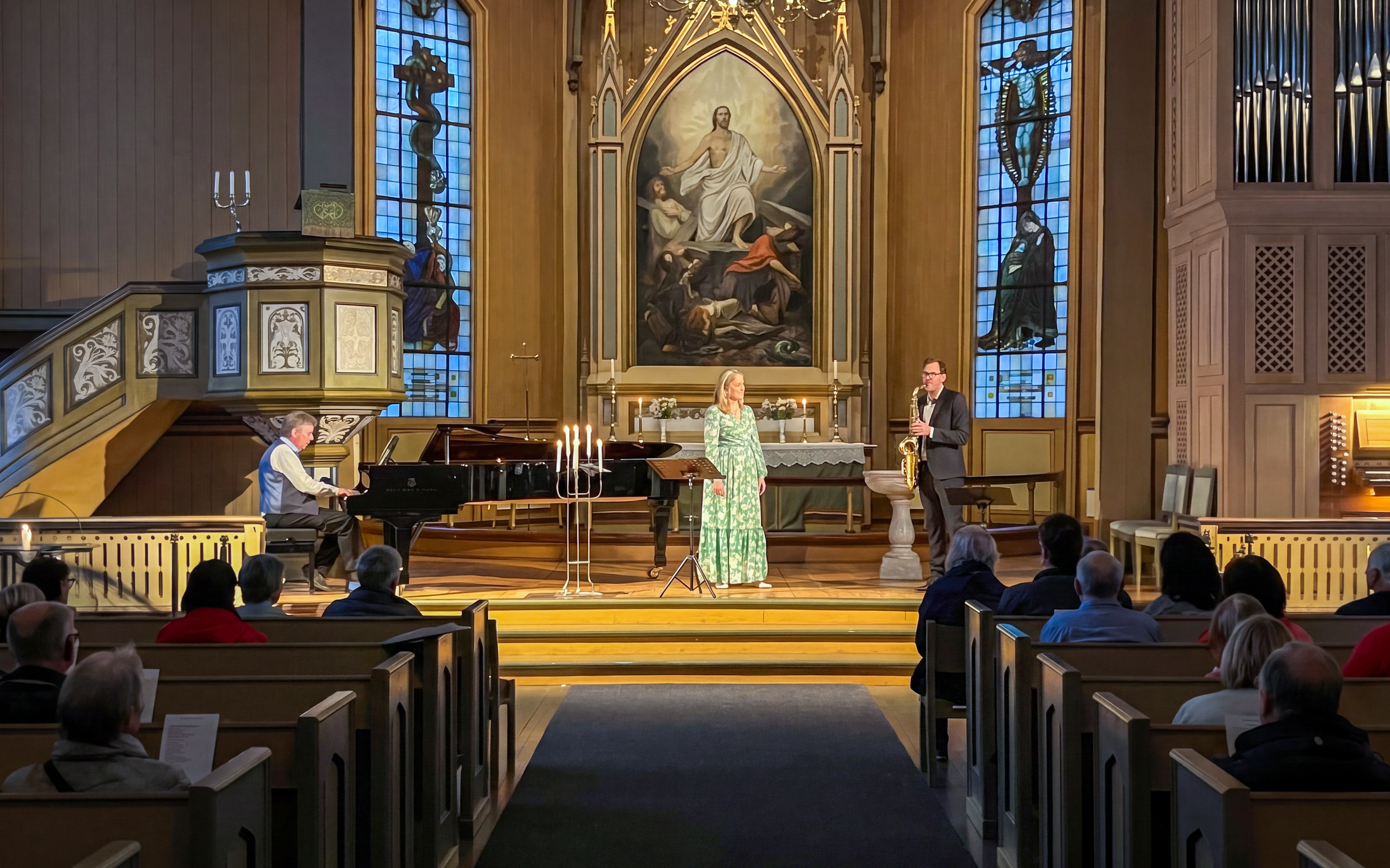 Musicians performing at midnight concert inside Tromso Cathedral, Norway.