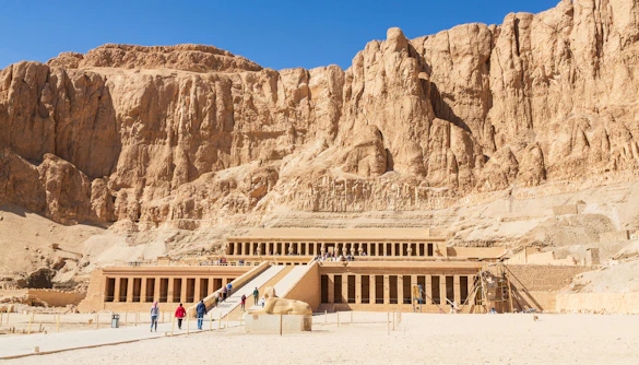 Temple of Hatshepsut in Luxor, Egypt with tourists exploring the ancient site.