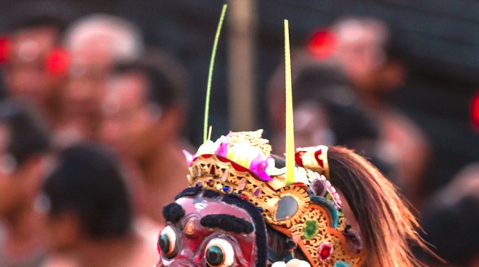 Performer in traditional costume at Uluwatu Kecak Fire Dance, Bali.