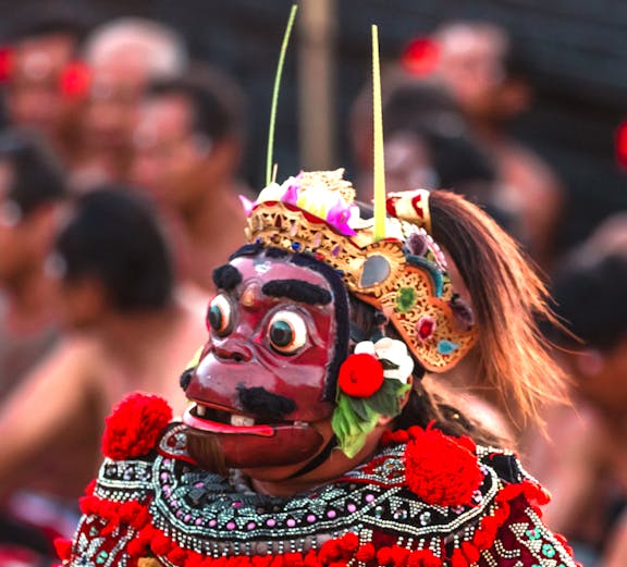 Performer in traditional costume at Uluwatu Kecak Fire Dance, Bali.