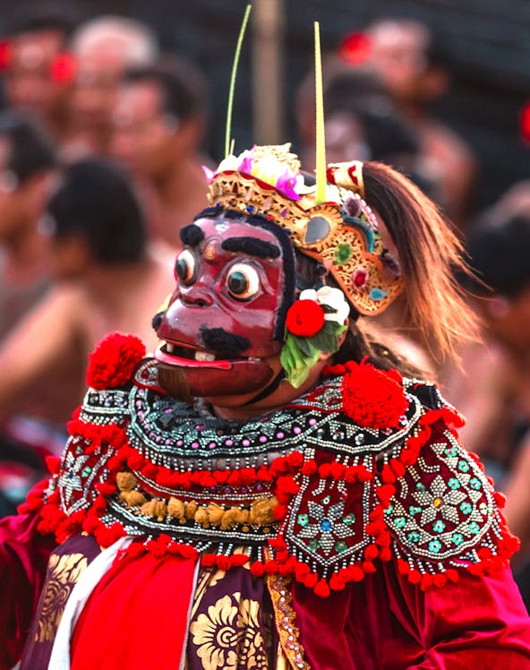 Performer in traditional costume at Uluwatu Kecak Fire Dance, Bali.