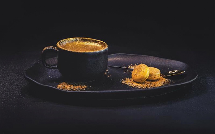 Coffee with gold dust and macarons at Sky 52 Restaurant, Sky View Observatory, Dubai.