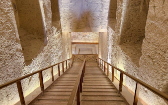 Staircase descending into ancient Egyptian tomb, Aswan, part of Nile Serenade tour.