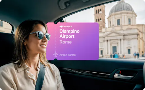 Woman in car during airport transfer from Ciampino Airport, Rome, with city view.