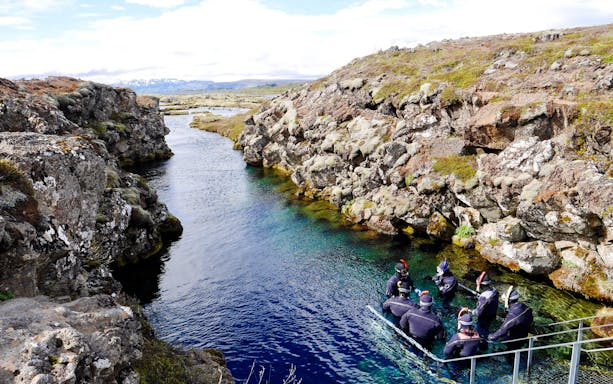 Snorkelers in Silfra rift, Thingvellir National Park, Iceland.