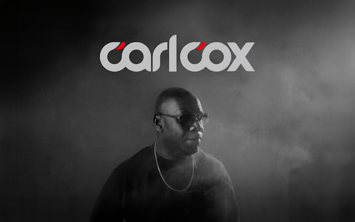 DJ performing in Ibiza with Carlcox logo in the background.