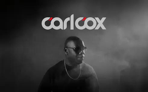 DJ performing in Ibiza with Carlcox logo in the background.