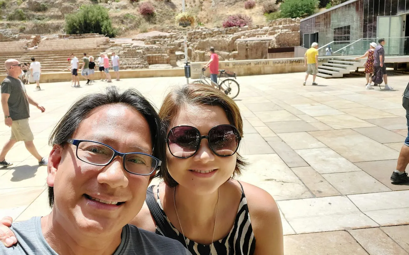 Visitors at the Roman Theatre in Malaga during a self-guided city exploration game.