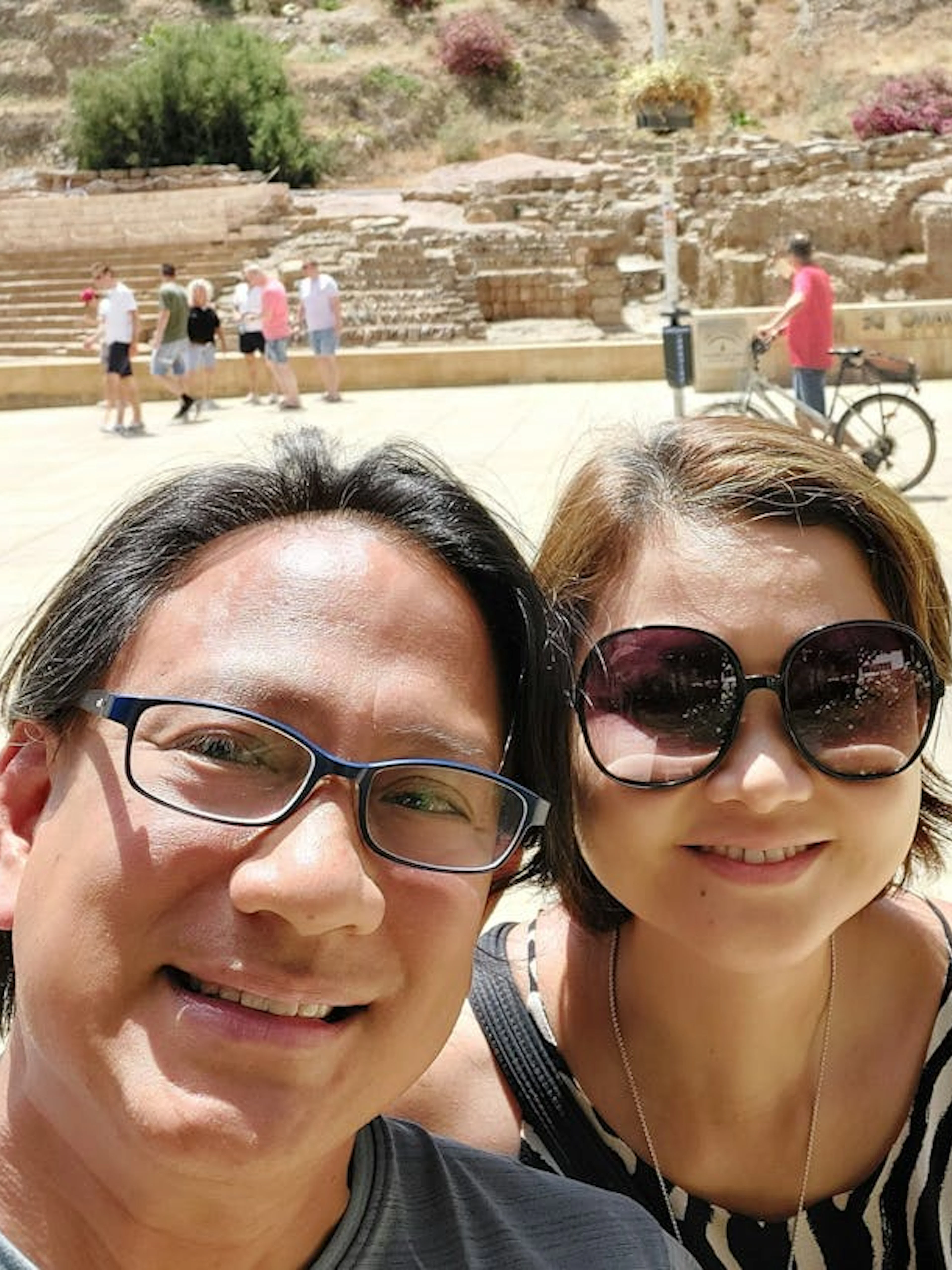 Visitors at the Roman Theatre in Malaga during a self-guided city exploration game.