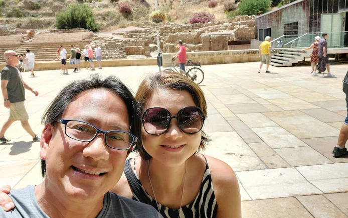 Visitors at the Roman Theatre in Malaga during a self-guided city exploration game.
