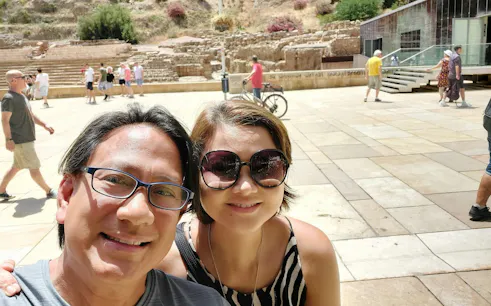 Visitors at the Roman Theatre in Malaga during a self-guided city exploration game.