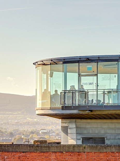 Gravity Bar exterior with panoramic views of Dublin cityscape and distant hills.