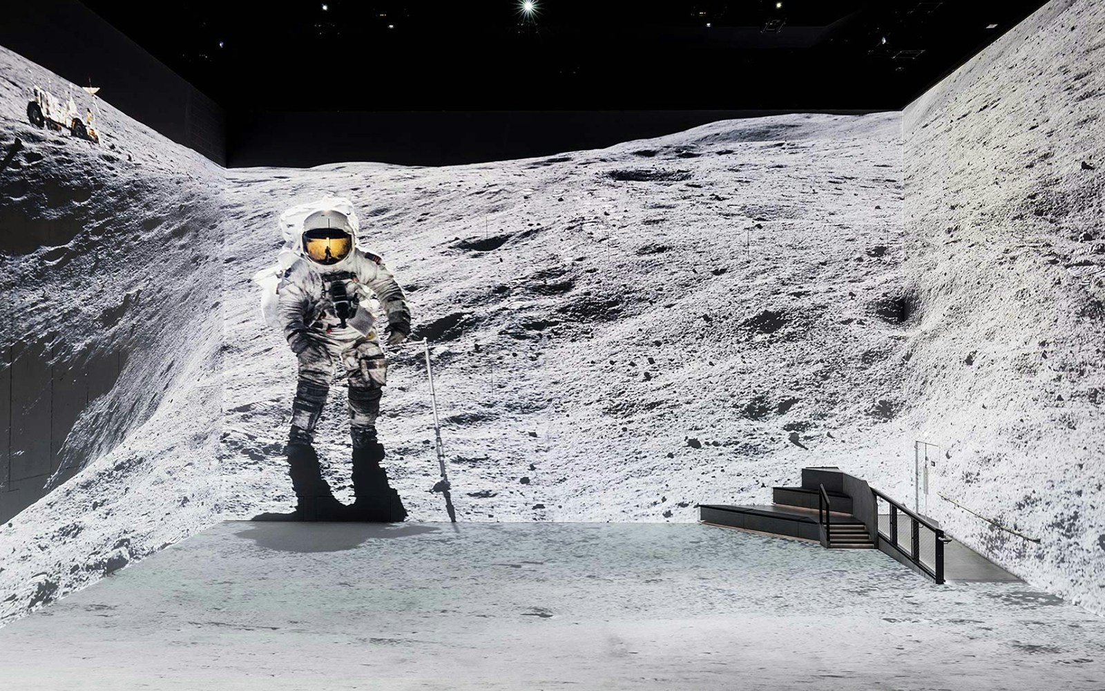 Astronaut walking on a simulated lunar surface for The Moonwalkers tour.