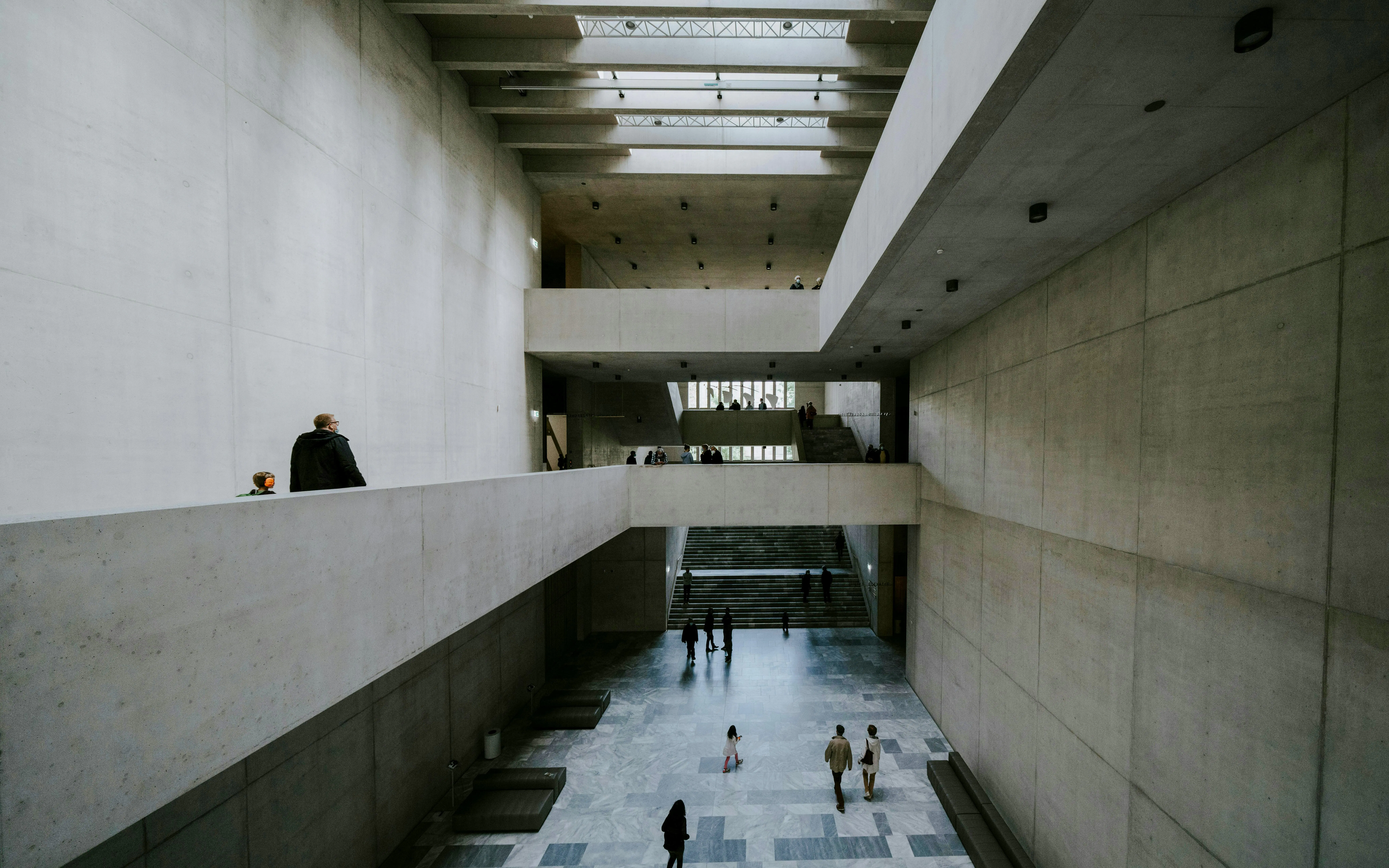Kunsthaus Zürich museum interior with visitors walking through spacious concrete halls.