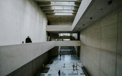 Kunsthaus Zürich museum interior with visitors walking through spacious concrete halls.