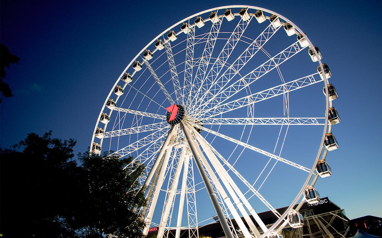 Ferris wheel at South Bank, Brisbane against a clear sky.