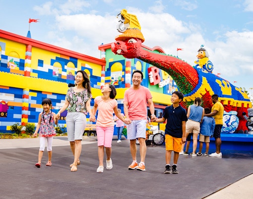 Guests enjoying a day at Legoland New York with colorful Lego structures.