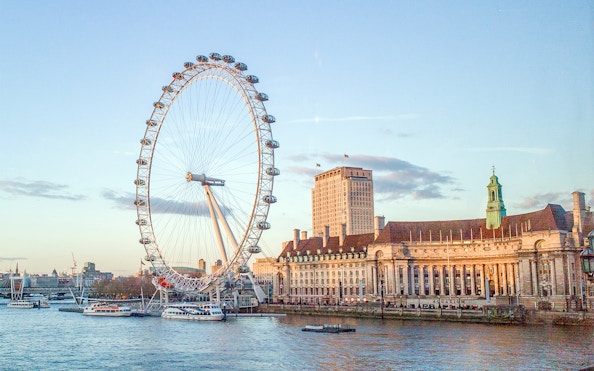 London Eye and County Hall viewed from a river cruise.