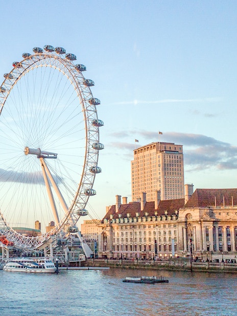 London Eye and County Hall viewed from a river cruise.