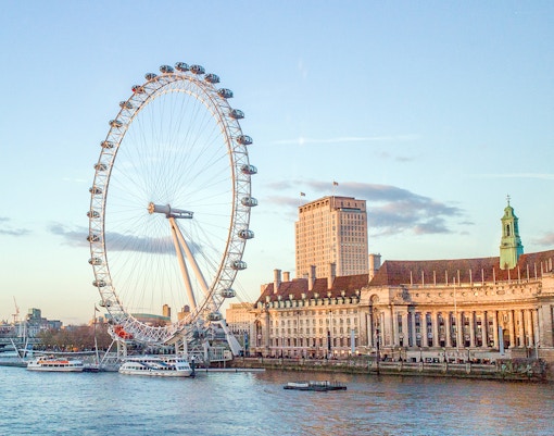 London Eye and County Hall viewed from a river cruise.