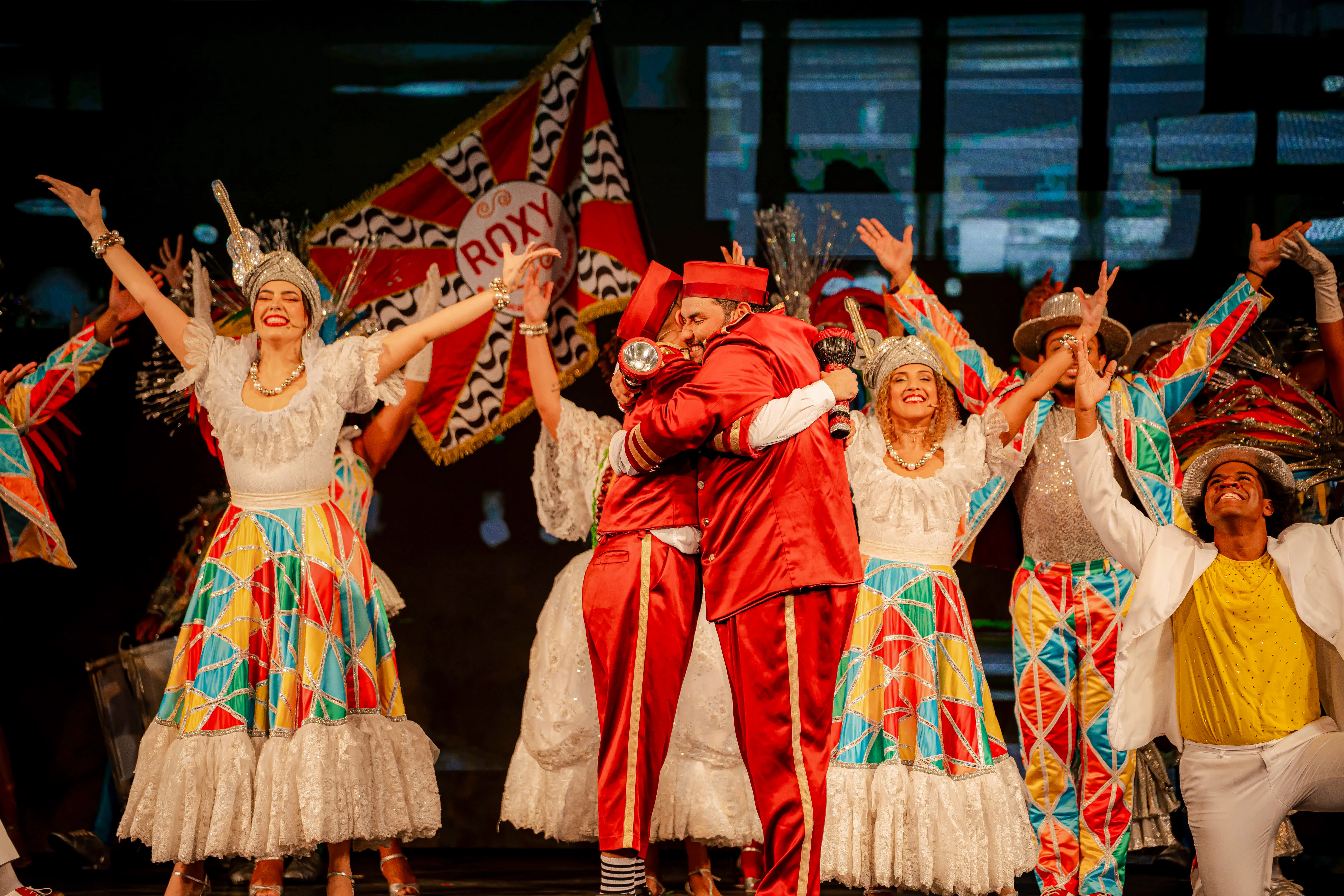 Performers in colorful costumes at Roxy Dinner Show, Rio de Janeiro.