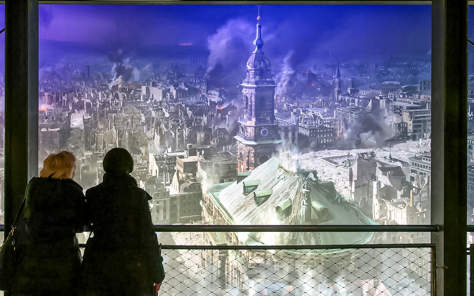 Visitors viewing Dresden cityscape panorama at Panometer Dresden.