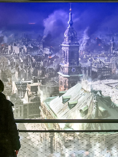 Visitors viewing Dresden cityscape panorama at Panometer Dresden.