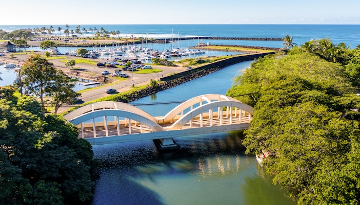 Aerial shot of the river anahulu and the twin arched road bridge in the North Shore town of Haleiwa